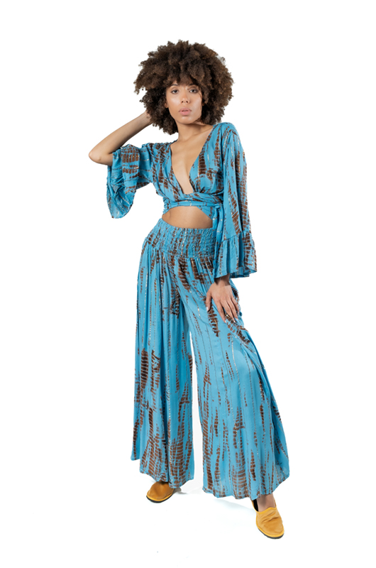 Studio image: Another pose of the same sky blue tie-dye lurex outfit, showing the top from the front.