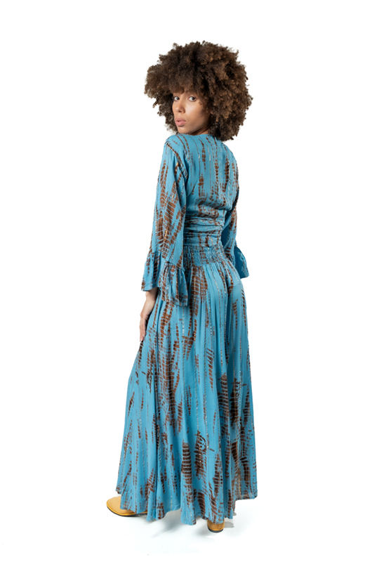 Back view of the sky blue and rust tie-dye lurex set, showing the drape and flow of the wide-leg pants.