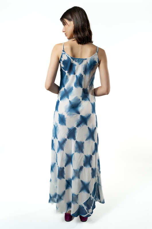 Back view of the bias-cut dress, showing the drape and thin straps.