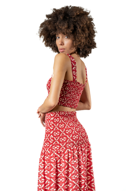 Close-up of bohemian red patterned co-ord set – smocked crop top and high waist long skirt