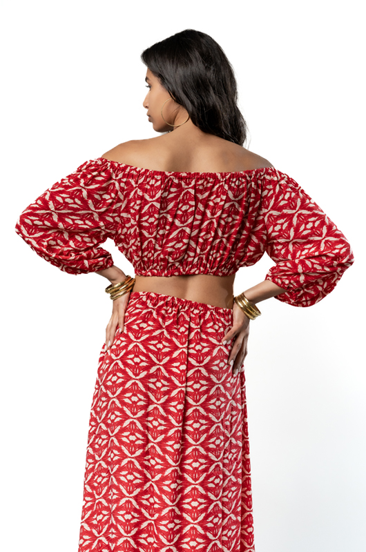 Back view of red off-shoulder bohemian maxi dress with balloon sleeves and shirred cropped top