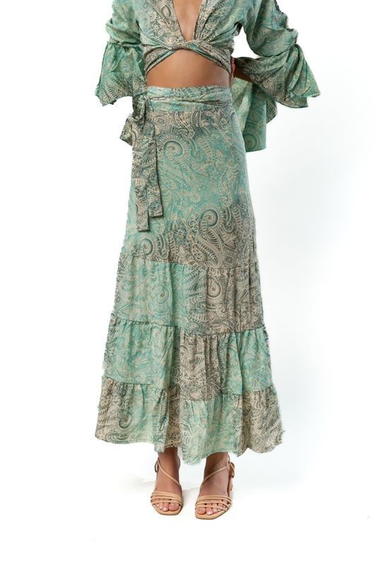 Detail of the skirt’s front showing the self-tie waist and tiered hemline.