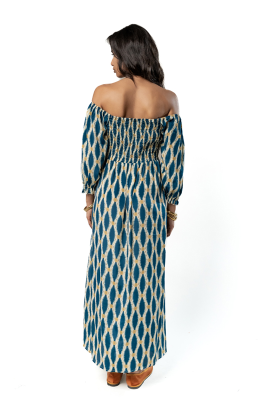 Back view of long blue off-shoulder dress with elastic bodice and elegant geometric print