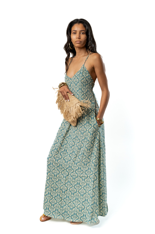 Side view of the same green patterned dress.