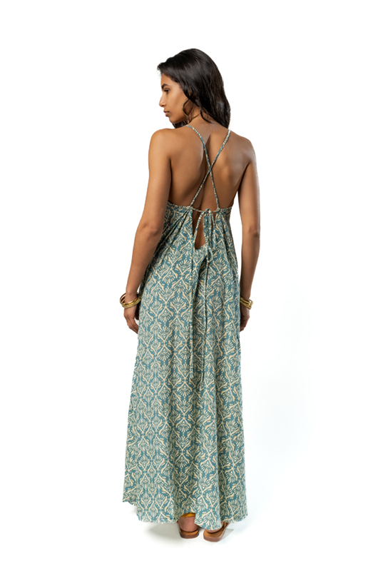 Back view of the green patterned dress, showing the criss-cross tie and open back.