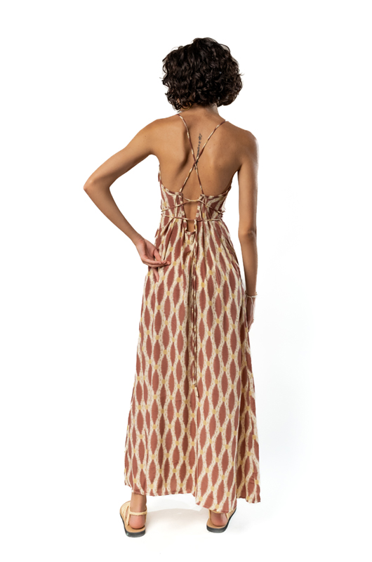 Back view of the same dress showing criss-cross tie details and an open back design.