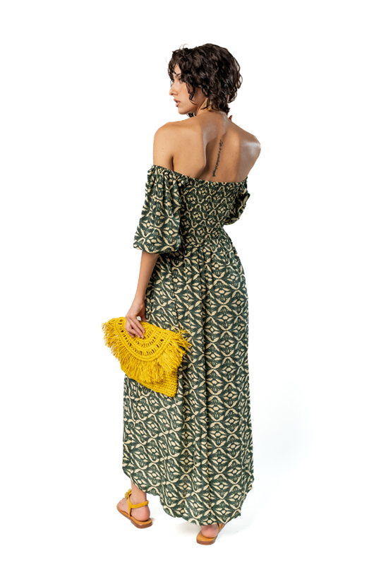 Back view of long green off-shoulder ethnic print dress with bare shoulders