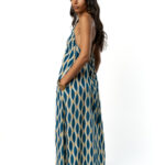 Side view of the same blue patterned maxi dress.