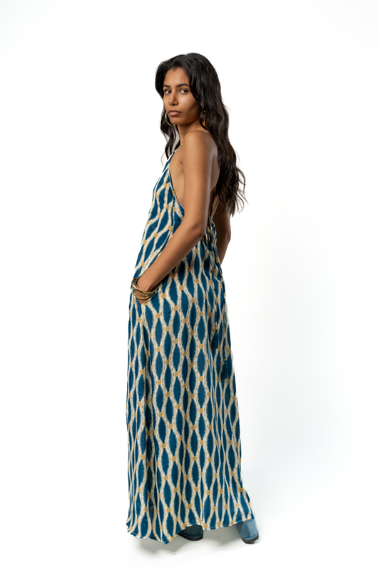 Side view of the same blue patterned maxi dress.