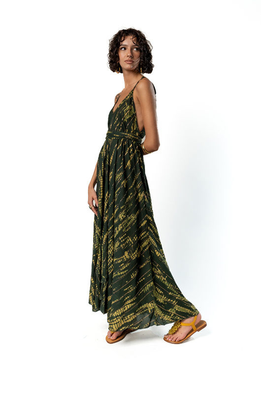 "Side view of a sleeveless green and yellow tie-dye maxi dress with a deep V-neck and flared skirt."