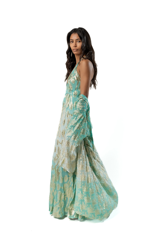 "Model in a turquoise and gold metallic halter maxi dress, with the matching kimono casually draped off one shoulder."