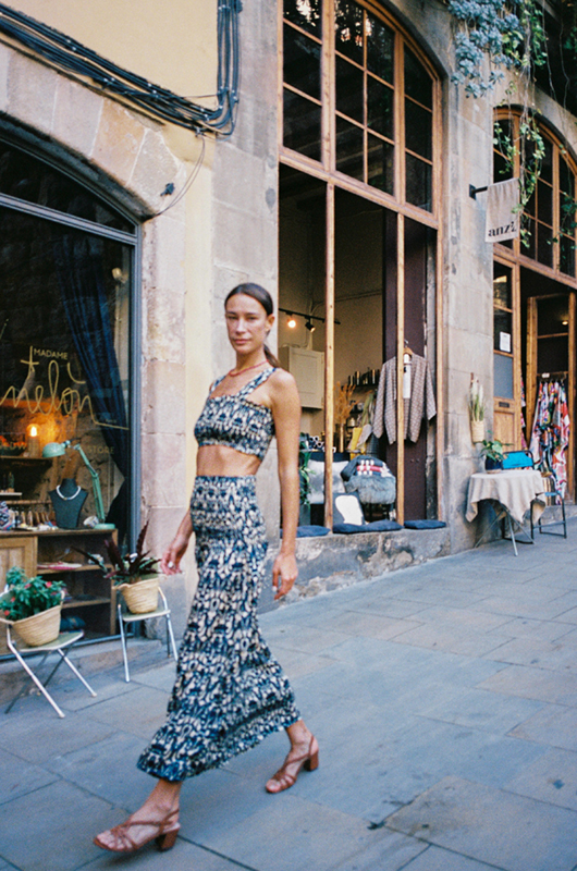 "Stylish boho chic black and white silk crop top and long skirt set walking street style"